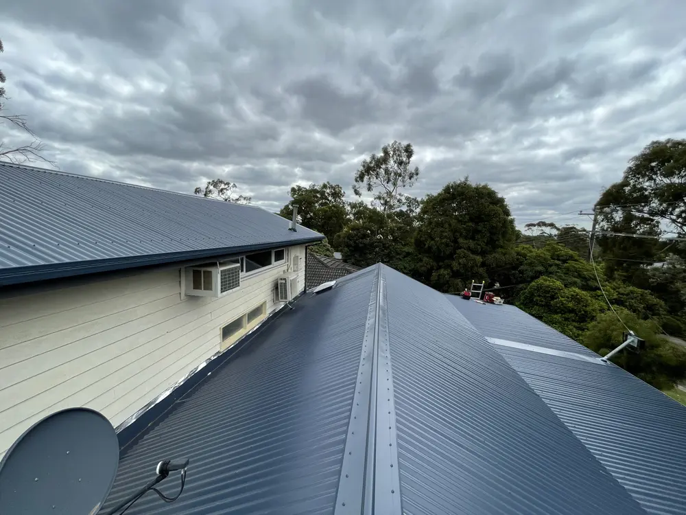 The same home after a full Colorbond re-roof in a dark grey
