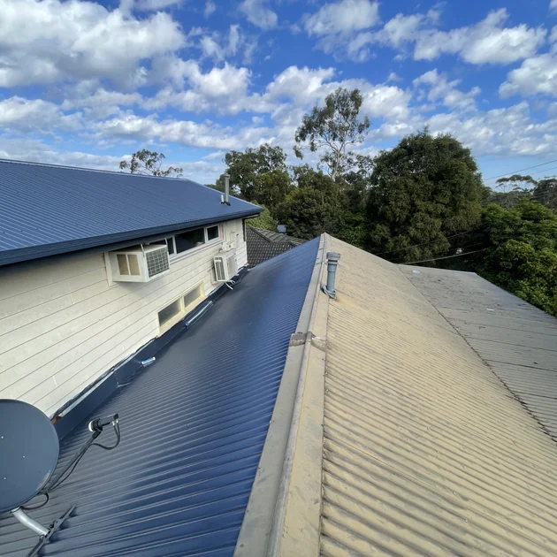 Repaired ridge and metal roof sheets on a Melbourne home