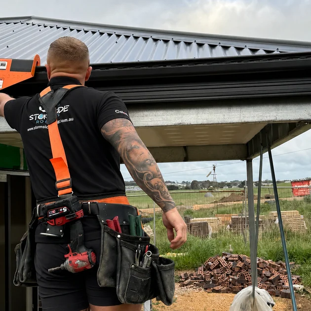 Stormside roof plumber working on a roof repair in Melbourne