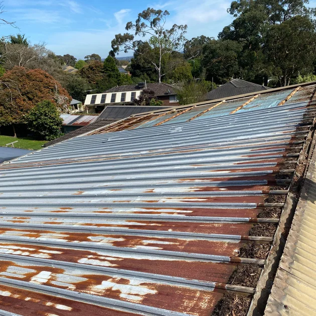 Rust breaking through old metal roof sheets in Melbourne