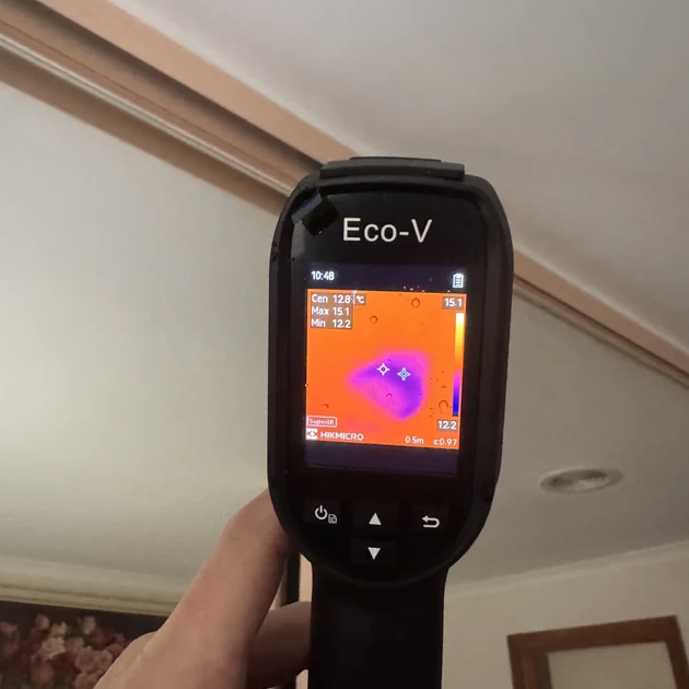 Thermal camera scanning a ceiling to locate a roof leak in Melbourne