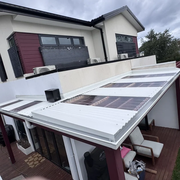 Low pitch roof over a deck rebuilt with correct falls in Melbourne